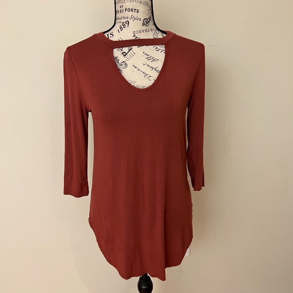 Reddish brown (brick color) stretchy long shirt with cut out in front size med